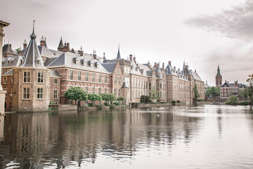 Amazing Binnenhof Palace in The Hague (Den Haag). Dutch Parliament buildings. Famous castle with fountains in front of it. The Netherlands, The Hague. 