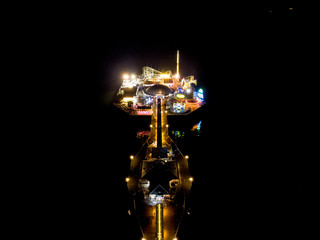 Fototapeta na wymiar Brighton Pier from above higher front on view, Drone shot of Pier at night, beach front amusement arcade