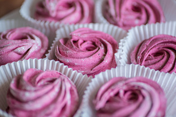 Pink home-made marshmallows with black currant.