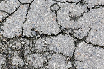 the texture of the old asphalt with crack