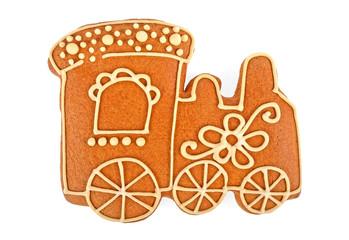 Decorated homemade gingerbread cookie isolated on white background. Shape of locomotive.