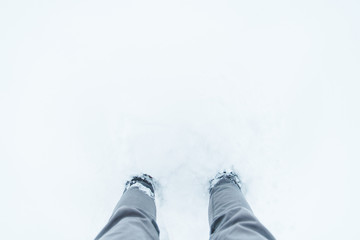 legs in snow close up overhead view