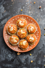 Carrot Halwa Laddu or sweet balls,  served in a plate with dry fruits toppings. selective focus