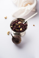 Beetroot Halwa garnished with Pistachio served in a bowl, selective focus
