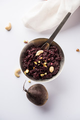 Beetroot Halwa garnished with Pistachio served in a bowl, selective focus