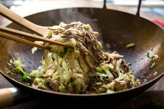 Close up of stir fried soba noodles with turkey and cabbage