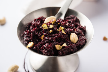 Beetroot Halwa garnished with Pistachio served in a bowl, selective focus