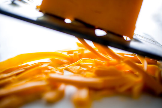 Close Up Of Grating Cheddar Cheese 