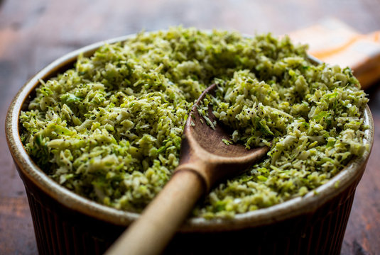 Close up of hashed brussels sprouts with lemon zest in bowl