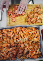 Frozen raw tiger royal shrimps on the wooden board