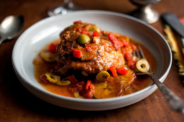 Close up of chicken stew with sweet plantains served on plate