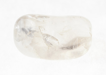 polished rock crystal (quartz) gemstone on white