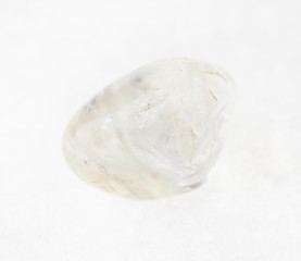 polished quartz ( rock crystal) gemstone on white