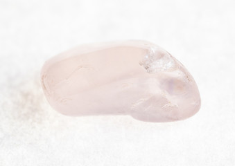 polished rose quartz gemstone on white