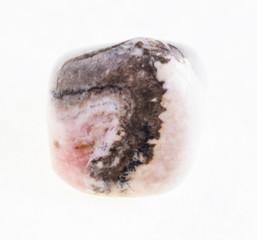 polished rhodochrosite stone on white