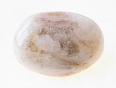 tumbled albite (moonstone) stone on white
