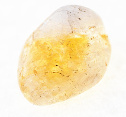 tumbled Citrine (yellow quartz) gem on white