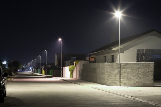 village street with modern LED streetlights at night