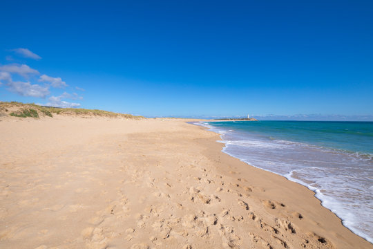 beautiful and idyllic landscape of wild natural long beaches of Zahora and Cala Isabel, near Canos Meca village (Barbate, Cadiz, Andalusia, Spain) and Cape Trafalgar with lighthouse
