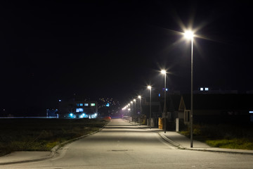 village street with modern LED streetlights at night