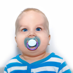 portrait of a cute baby with a pacifier in a striped suit