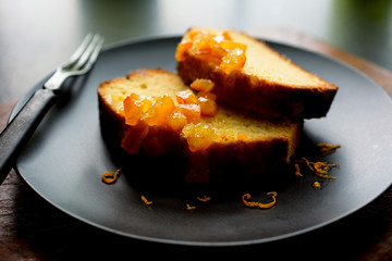 Close up of sliced orange marmalade cake served on plate