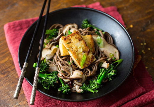 Close up of stir fried soba noodles served in bowl