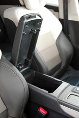 Open storage box between front car seats