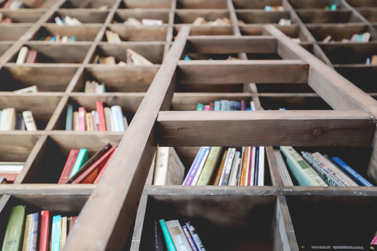 Old bookshelf with books and ladder