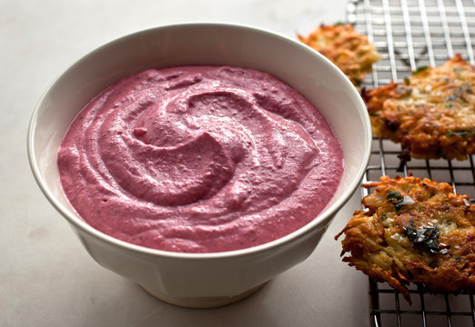 Close up of garlicky beet spread with yogurt in bowl