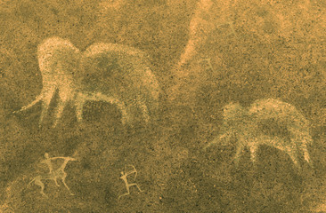 image of ancient mammoths and hunters on the cave wall. the history of the antiquities era.