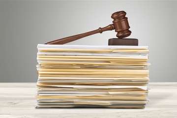 Judge hammer and documents on  background