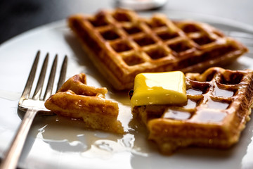 Close up of butter melting on yeasted waffles
