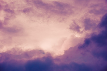 Obraz premium Pink and violet, dark dramatic clouds in sky. Copy space. For background and wallpaper