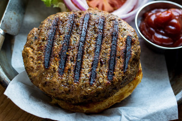 Close up of burger patty and sauce served on plate