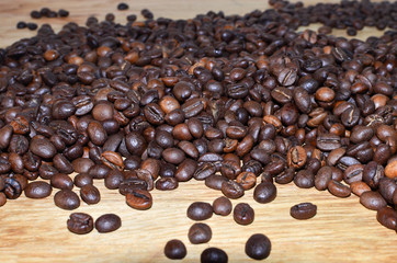 coffee beans, border on a wood background