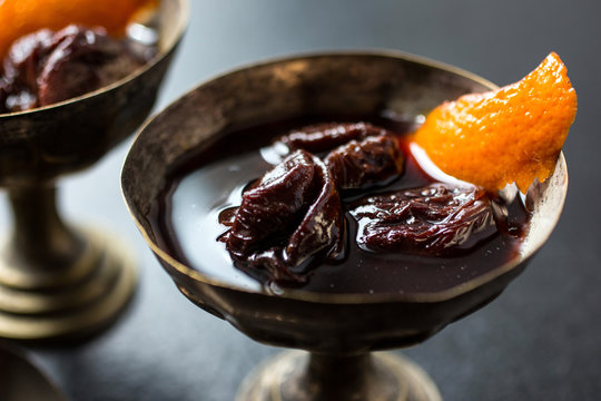 Close up of prunes poached in red wine