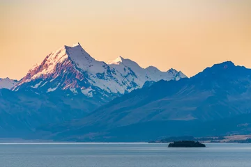 Peel and stick wall murals Aoraki/Mount Cook Beautiful landscape view of Mount Cook peak covered in snow at dusk after sunset seen across Lake Pukaki. Aoraki / Mount Cook National Park, New Zealand.