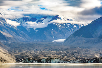 Fototapeta premium Tasman Glacier and lake with massive icebergs, pieces of melting ice. Aoraki / Mount Cook National Park, New Zealand.