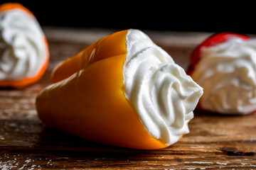 Close up of mini bell peppers stuffed with goat cheese 