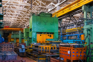 Large pressing machine in the industrial shop forging plant. 