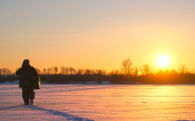 fisherman silhouette winter fishing on winter lake