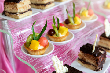 Mixed and assorted fruits tart with kiwi and grape for party or wedding, gastronomy, event organization concept.
