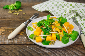 corn salad and baked pumpkin.