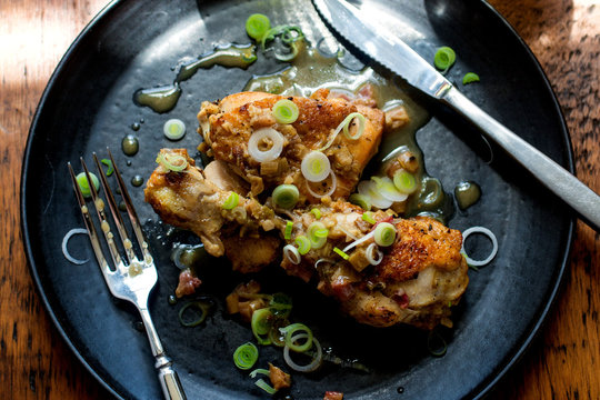 Close up of smothered chicken served on plate