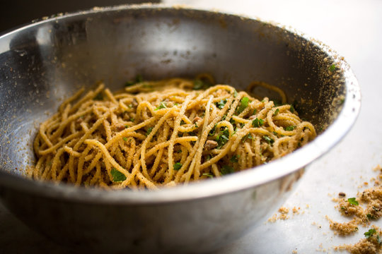 Close up of pasta with garlicky breadcrumbs and anchovies in bowl