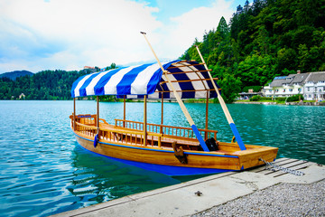 Gondolla with a striped roof on Lake Bled in Slovenia.