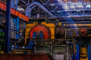 Fototapeta na wymiar Production machines, equipment and heavy iron stamping in the industrial shop forge plant. Manufacture of auto parts