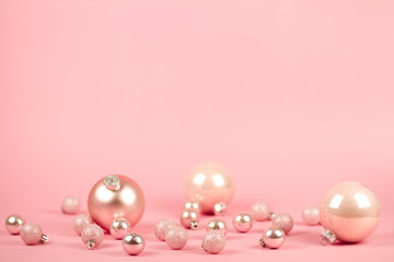 Fashion ?hristmas decoration on pink background. Closeup of pink christmas . Trendy minimal concep. pastel color