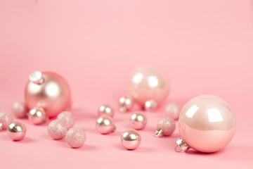 Fashion сhristmas decoration on pink background. Closeup of pink christmas . Trendy minimal concep. pastel color